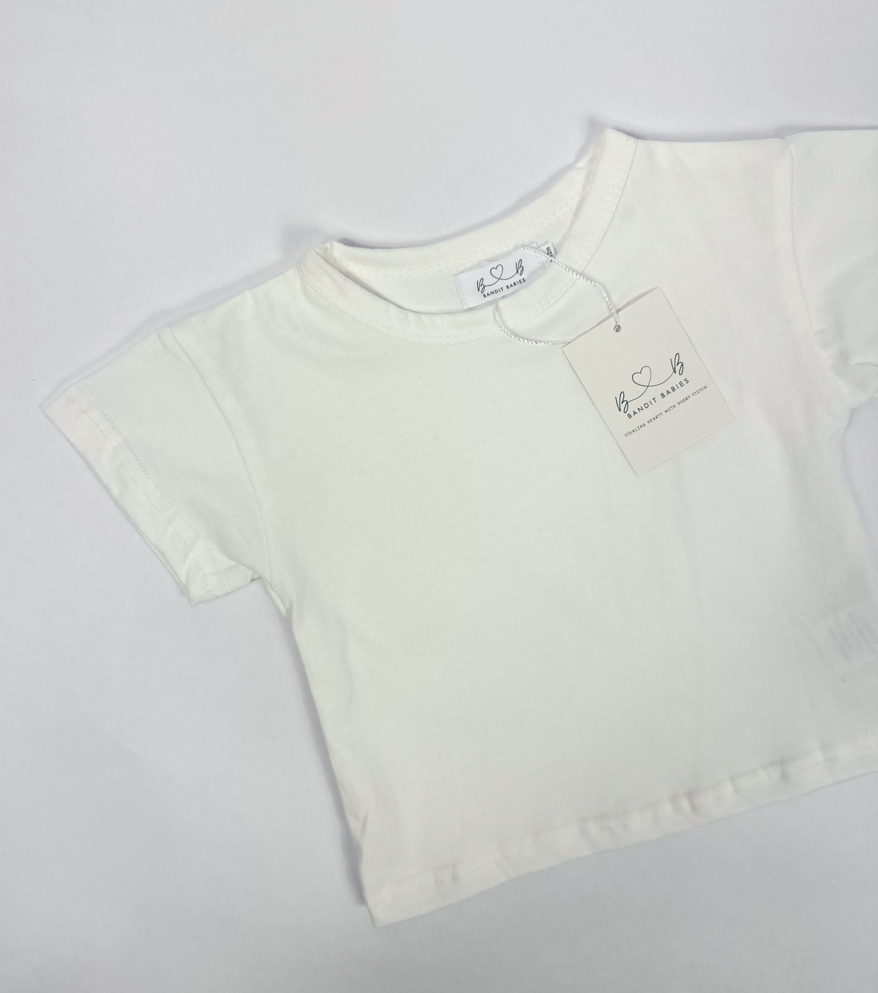 A toddler white-shirt on a white background.