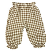 Brown and white checkered baby pants on a white background