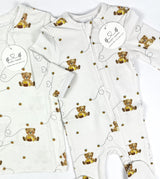 Baby footies with teddy bear pattern on a white background