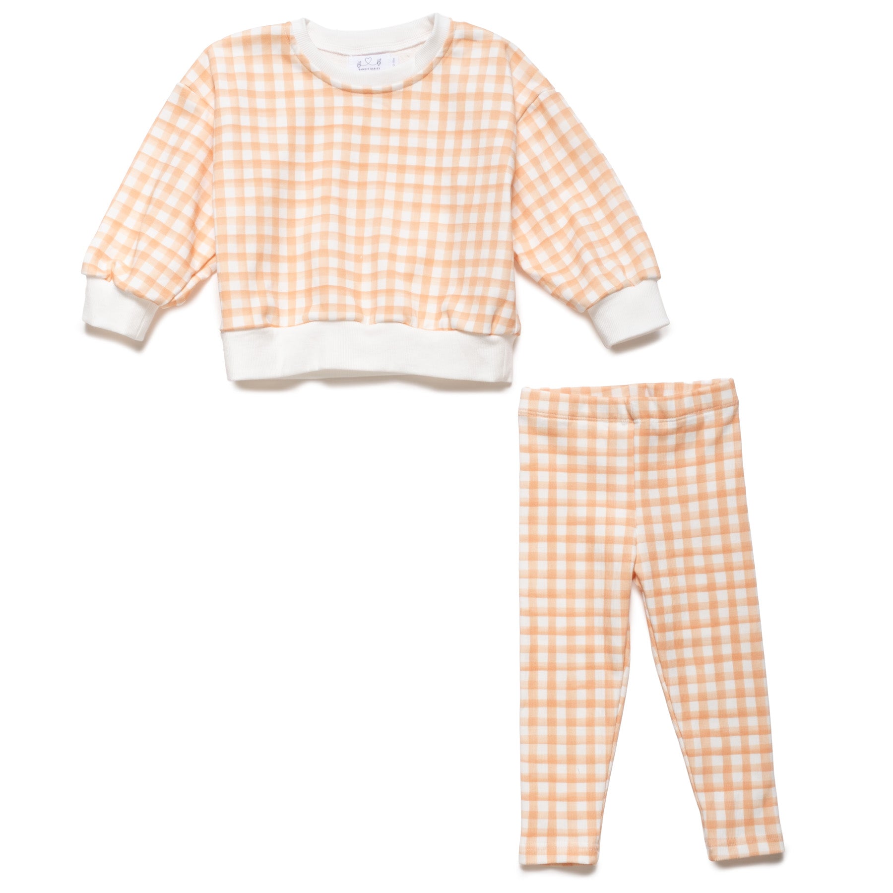 Toddler pajama set with orange and white checkered pattern on a white background