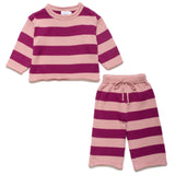 Pink and purple striped sweater and pants set on a white background