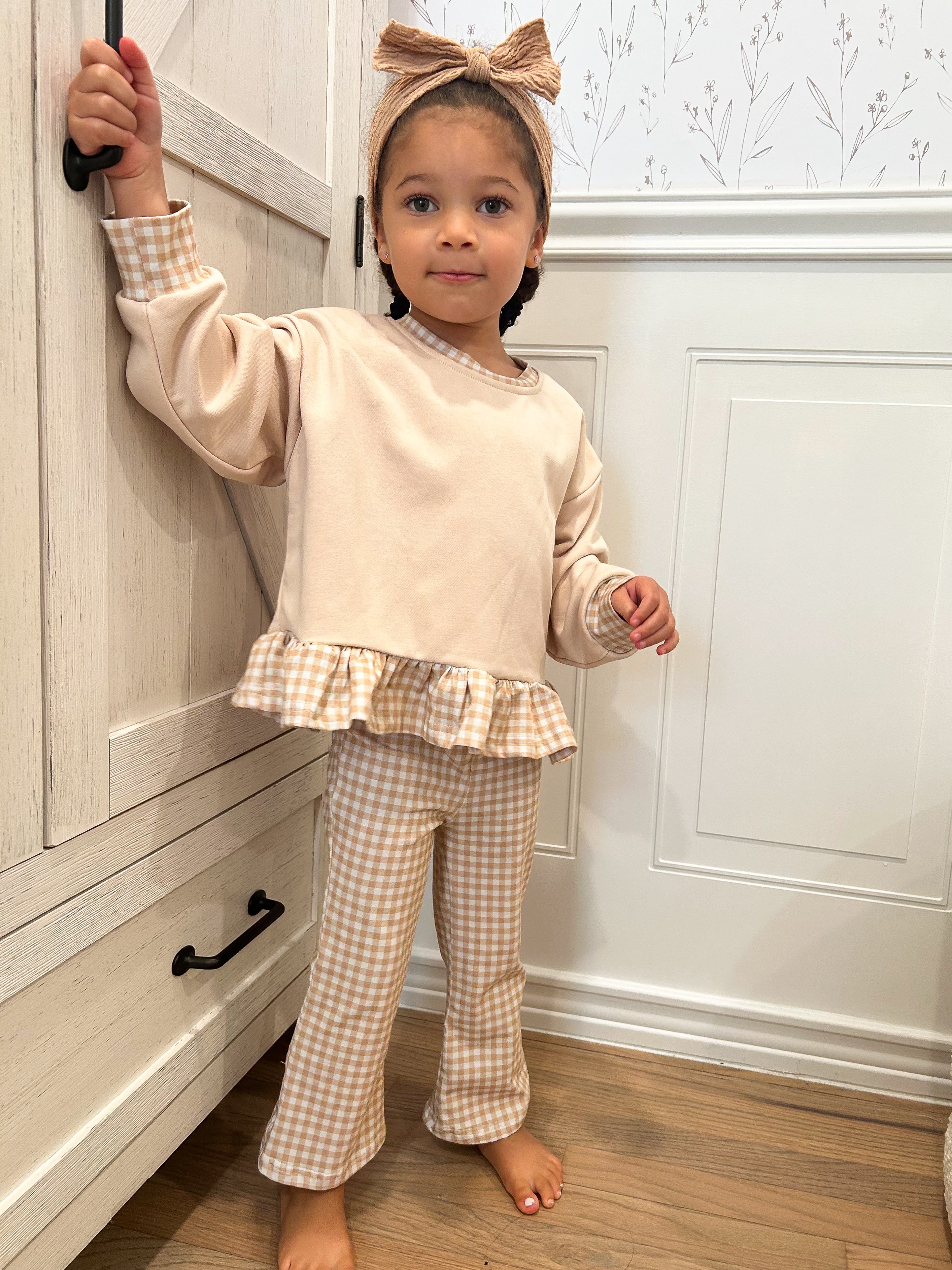 a girl standing in front of a door