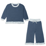 A two-piece baby knit set featuring a long-sleeve top and matching pants in a textured slate blue fabric with a light blue ruffle trim, a white collar, and a white drawstring waist.