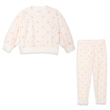 A two-piece children's outfit set featuring a long-sleeve sweatshirt and matching pants in a pale pink color with a light peach polka dot pattern, displayed on a clean white background.