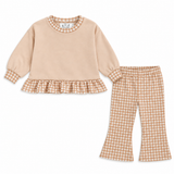 a beige and white outfit