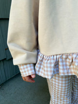 a person wearing a sweater and pants