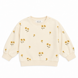 a white sweater with yellow flowers on it