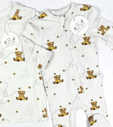 Baby footies with teddy bear pattern on a white background