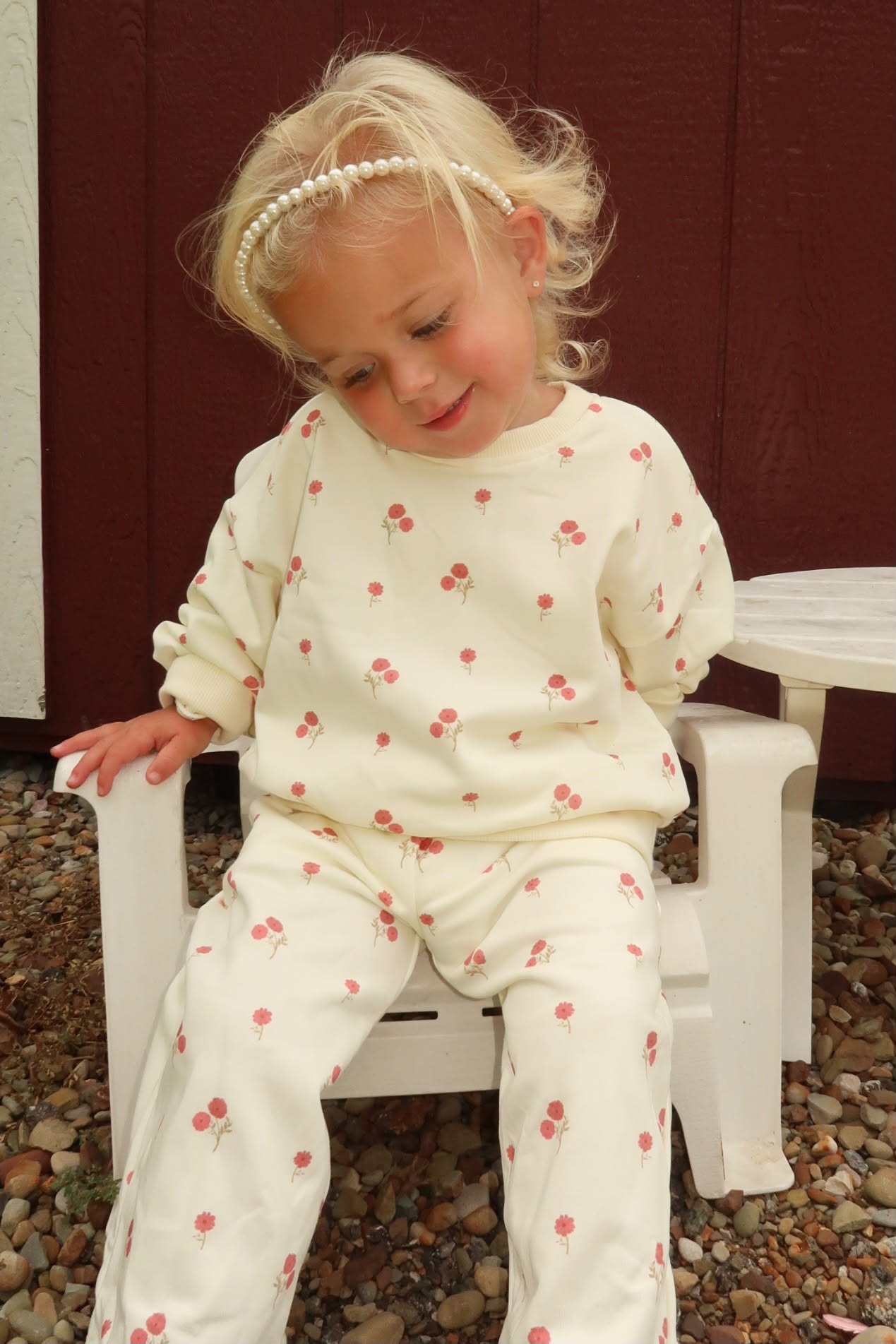 a girl sitting on a chair