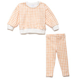 Toddler outfit set with orange and white checkered pattern on a white background